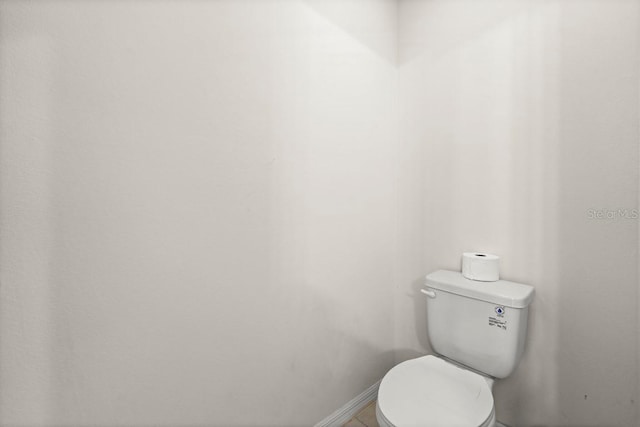 588 Meadow Bend Dr, Davenport, FL 33837 - bathroom with toilet and baseboards