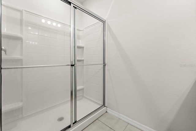 588 Meadow Bend Dr, Davenport, FL 33837 - full bath with a stall shower and tile patterned floors
