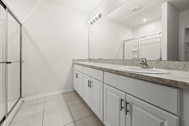 588 Meadow Bend Dr, Davenport, FL 33837 - full bath with double vanity, tile patterned flooring, and a stall shower