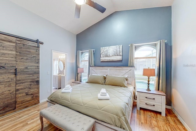 120 Bloomingdale Dr, Davenport, FL 33897 - bedroom featuring wood finished floors, high vaulted ceiling, ensuite bathroom, and a ceiling fan