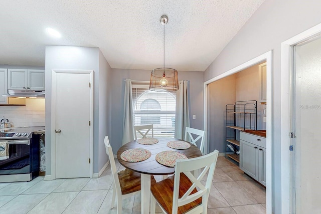 120 Bloomingdale Dr, Davenport, FL 33897 - dining area with light tile patterned floors, a textured ceiling, and lofted ceiling
