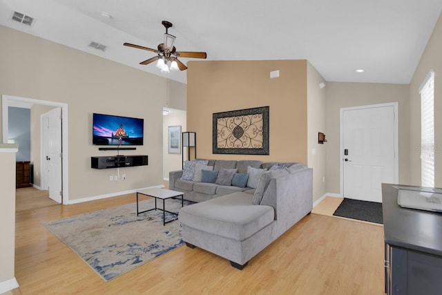 2892 Kokomo Loop, Haines City, FL 33844 - living area featuring light wood-style floors, a ceiling fan, lofted ceiling, and recessed lighting
