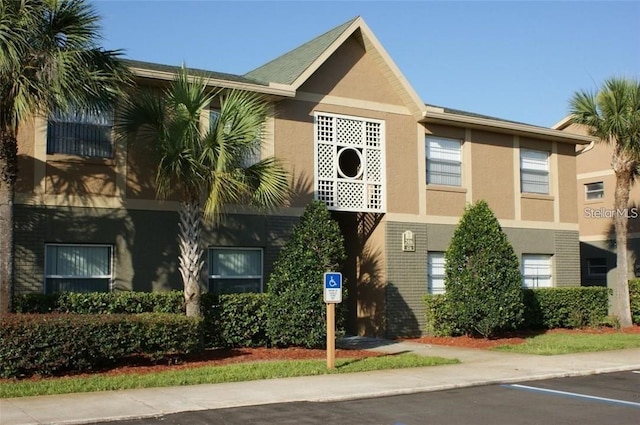 2408 Barley Club Ct Unit 7, Orlando, FL 32837 - view of property with uncovered parking