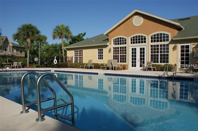 2408 Barley Club Ct Unit 7, Orlando, FL 32837 - community pool with french doors and a patio area