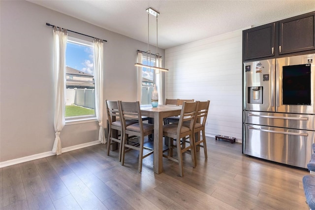 9878 Aurea Moss Ln, Orlando, FL 32832 - dining room with healthy amount of natural light and dark wood-type flooring