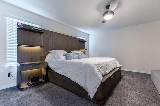 9878 Aurea Moss Ln, Orlando, FL 32832 - bedroom with dark carpet and a ceiling fan