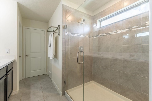 9878 Aurea Moss Ln, Orlando, FL 32832 - bathroom featuring a stall shower, vanity, and tile patterned flooring