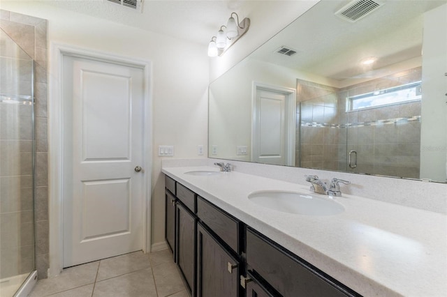 9878 Aurea Moss Ln, Orlando, FL 32832 - full bathroom featuring double vanity, a stall shower, and tile patterned flooring