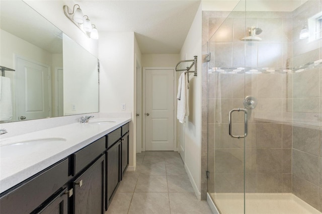 9878 Aurea Moss Ln, Orlando, FL 32832 - bathroom with double vanity, a stall shower, and tile patterned flooring