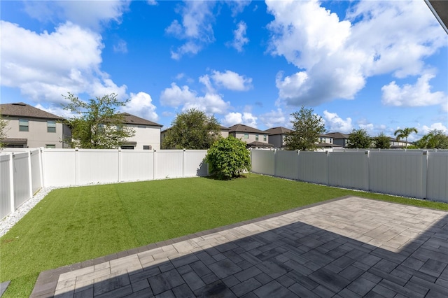 9878 Aurea Moss Ln, Orlando, FL 32832 - fenced backyard featuring a patio area and a residential view