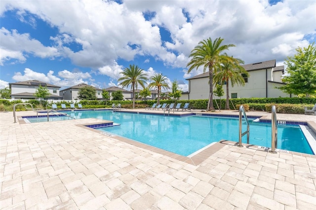 9878 Aurea Moss Ln, Orlando, FL 32832 - community pool featuring a patio area