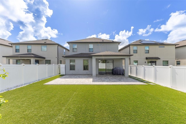 9878 Aurea Moss Ln, Orlando, FL 32832 - back of house featuring a patio area, a fenced backyard, stucco siding, and a shingled roof