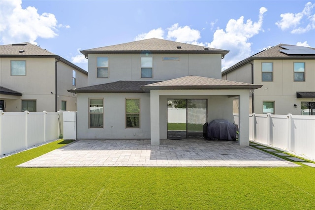 9878 Aurea Moss Ln, Orlando, FL 32832 - rear view of property with stucco siding, a patio area, and a fenced backyard