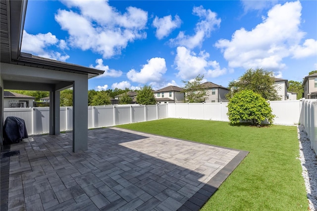 9878 Aurea Moss Ln, Orlando, FL 32832 - fenced backyard featuring a patio and a residential view