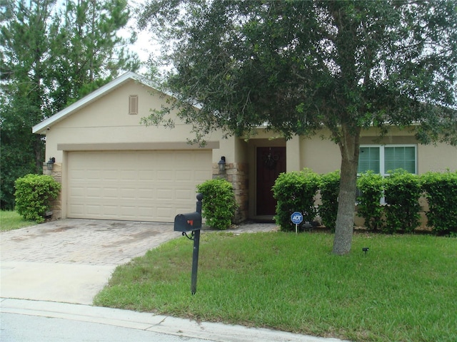 301 Sierra Way, Davenport, FL 33837 - view of front of property with stucco siding, a garage, driveway, and a front lawn