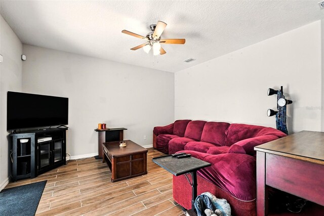 301 Sierra Way, Davenport, FL 33837 - living room featuring a ceiling fan and light wood-type flooring