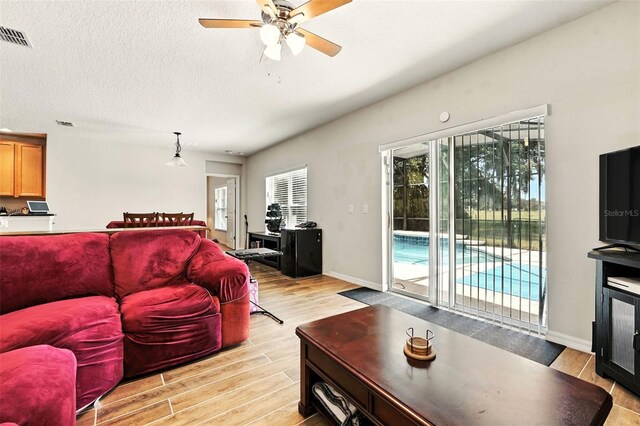 301 Sierra Way, Davenport, FL 33837 - living area with light wood-type flooring and ceiling fan