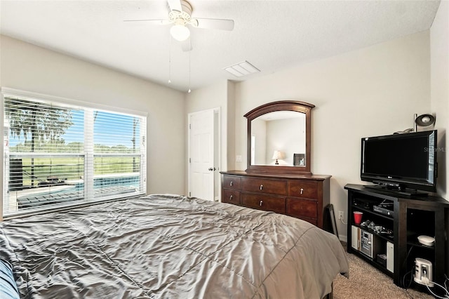 301 Sierra Way, Davenport, FL 33837 - carpeted bedroom featuring a ceiling fan
