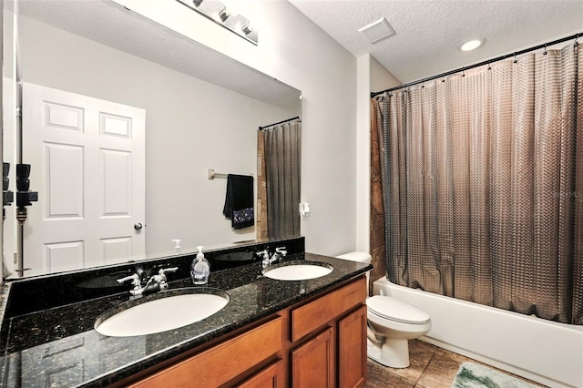 301 Sierra Way, Davenport, FL 33837 - bathroom featuring double vanity, shower / tub combo with curtain, and a textured ceiling