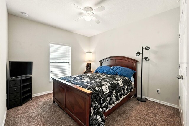 301 Sierra Way, Davenport, FL 33837 - carpeted bedroom with baseboards and ceiling fan