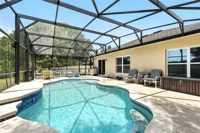 301 Sierra Way, Davenport, FL 33837 - view of swimming pool with a patio area and glass enclosure