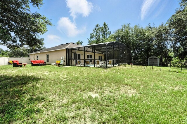 301 Sierra Way, Davenport, FL 33837 - fenced backyard with a storage shed, a lanai, and a patio area