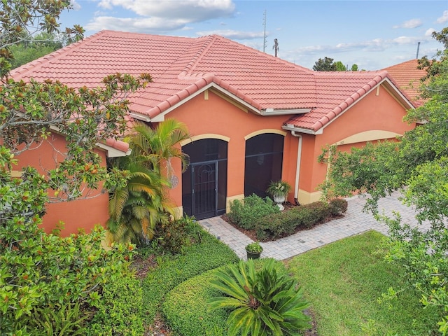 521 Milano Rd, Kissimmee, FL 34759 - mediterranean / spanish-style home with a tile roof and stucco siding