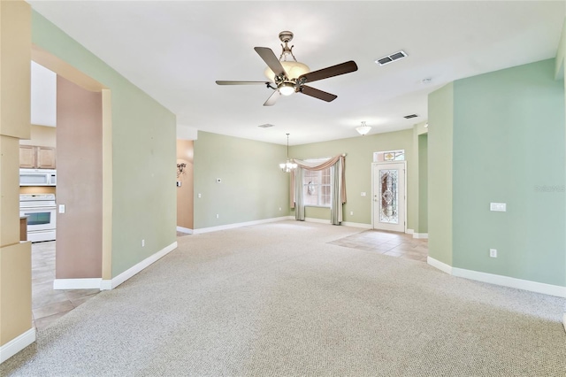 521 Milano Rd, Kissimmee, FL 34759 - unfurnished room with ceiling fan, light carpet, and a chandelier