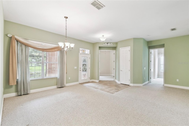521 Milano Rd, Kissimmee, FL 34759 - empty room with carpet and a chandelier