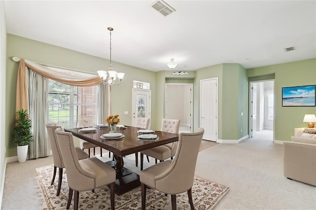 521 Milano Rd, Kissimmee, FL 34759 - dining area featuring light colored carpet and a chandelier