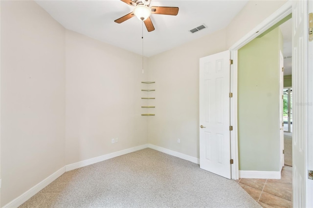 521 Milano Rd, Kissimmee, FL 34759 - spare room featuring a ceiling fan and light colored carpet