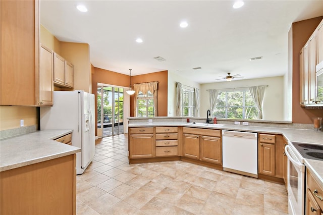 521 Milano Rd, Kissimmee, FL 34759 - kitchen with white appliances, a peninsula, recessed lighting, a ceiling fan, and light countertops