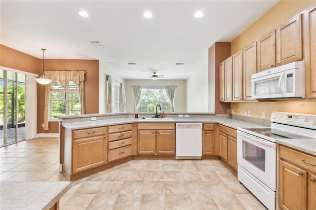 521 Milano Rd, Kissimmee, FL 34759 - kitchen featuring white appliances, a peninsula, light countertops, recessed lighting, and ceiling fan