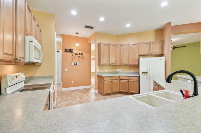 521 Milano Rd, Kissimmee, FL 34759 - kitchen featuring white appliances, light brown cabinetry, light countertops, a ceiling fan, and recessed lighting