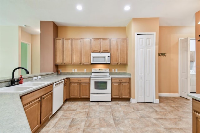 521 Milano Rd, Kissimmee, FL 34759 - kitchen featuring white appliances, light countertops, washer / clothes dryer, and recessed lighting