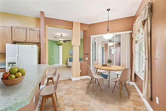 521 Milano Rd, Kissimmee, FL 34759 - dining area featuring ceiling fan and baseboards