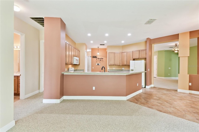 521 Milano Rd, Kissimmee, FL 34759 - kitchen featuring white appliances, a peninsula, light countertops, ceiling fan, and recessed lighting