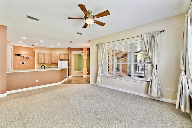 521 Milano Rd, Kissimmee, FL 34759 - unfurnished living room with light carpet, ceiling fan, and recessed lighting