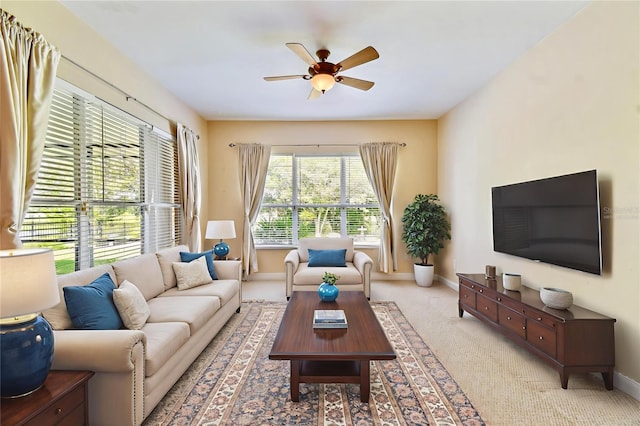 521 Milano Rd, Kissimmee, FL 34759 - carpeted living area with ceiling fan and baseboards