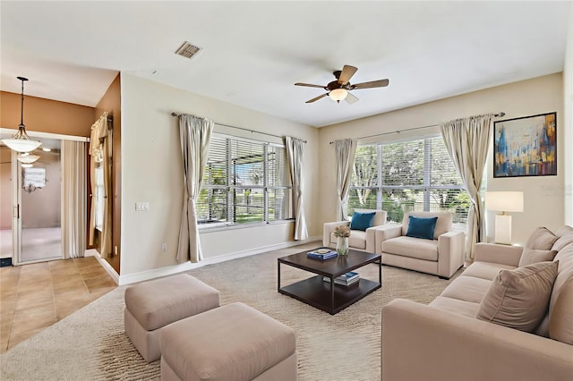 521 Milano Rd, Kissimmee, FL 34759 - living room with a ceiling fan and plenty of natural light