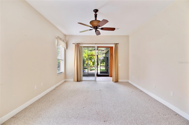 521 Milano Rd, Kissimmee, FL 34759 - unfurnished room featuring light carpet and a ceiling fan