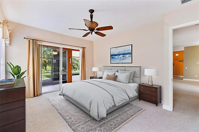 521 Milano Rd, Kissimmee, FL 34759 - bedroom featuring access to exterior, ceiling fan, and light colored carpet