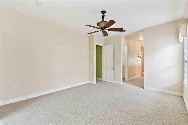 521 Milano Rd, Kissimmee, FL 34759 - unfurnished bedroom featuring light colored carpet and a ceiling fan