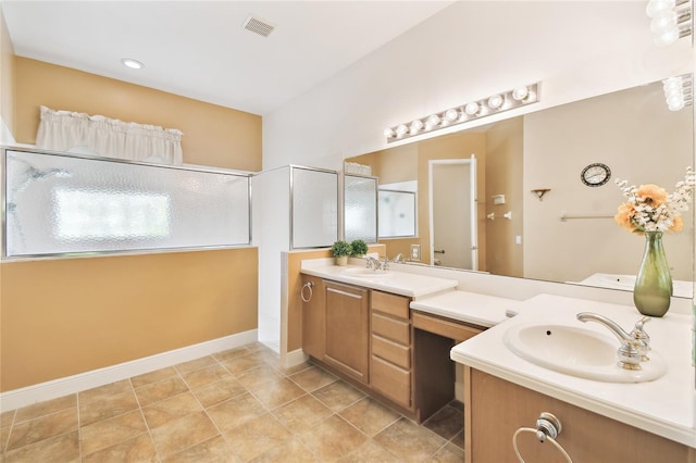 521 Milano Rd, Kissimmee, FL 34759 - bathroom with vanity, an enclosed shower, and tile patterned floors