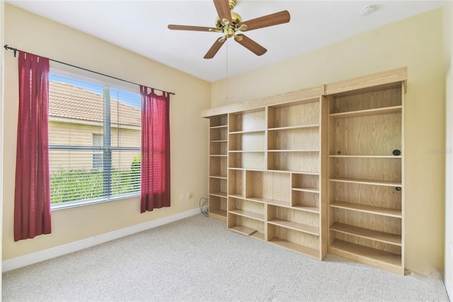521 Milano Rd, Kissimmee, FL 34759 - spare room featuring carpet floors, a smoke detector, a ceiling fan, and plenty of natural light