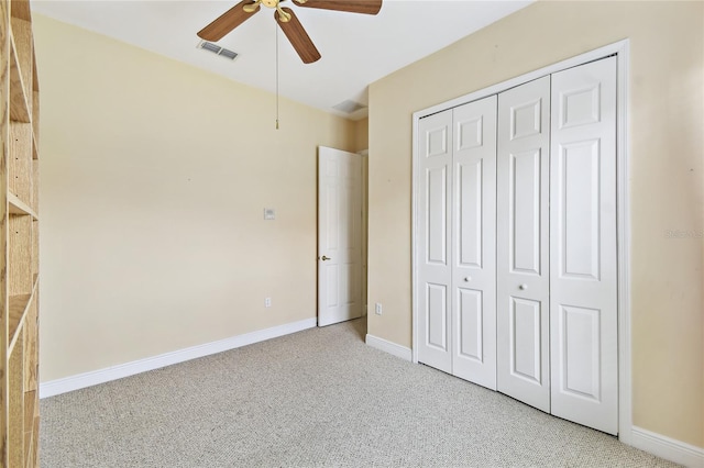 521 Milano Rd, Kissimmee, FL 34759 - unfurnished bedroom with light colored carpet, a closet, and a ceiling fan