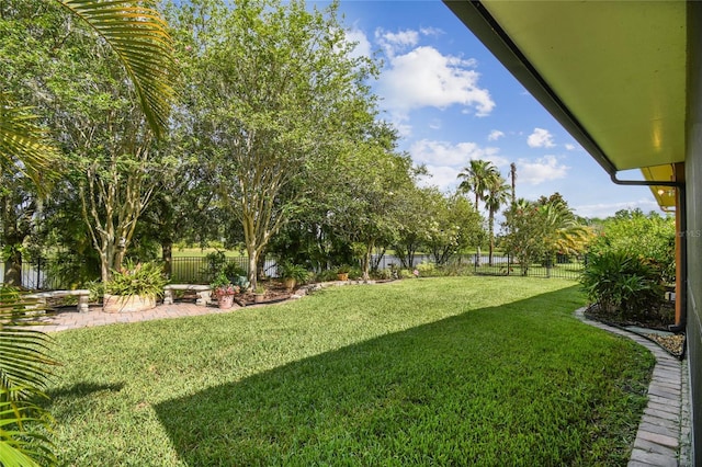 521 Milano Rd, Kissimmee, FL 34759 - fenced backyard with a patio area