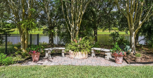521 Milano Rd, Kissimmee, FL 34759 - fenced backyard with a patio and view of wooded area