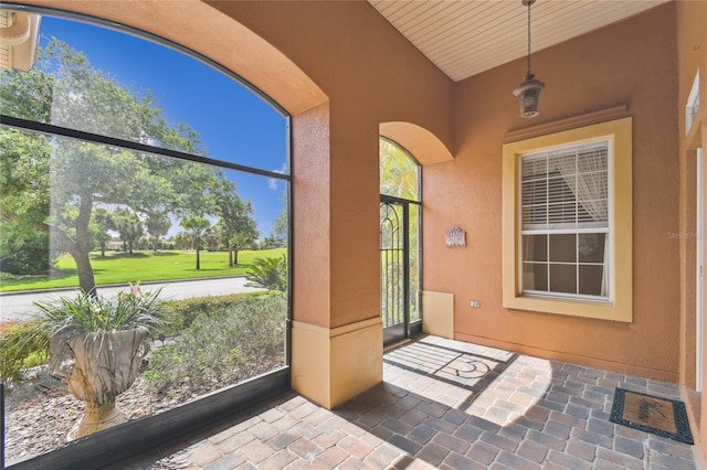 521 Milano Rd, Kissimmee, FL 34759 - unfurnished sunroom featuring lofted ceiling