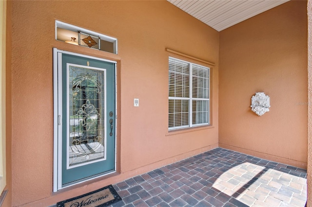 521 Milano Rd, Kissimmee, FL 34759 - doorway to property with stucco siding